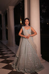 AQUA BLUE NET LEHENGA EMBELLISHED WITH SEQUINS,CUT DAANA AND A TOUCH OF MIRROR WORK