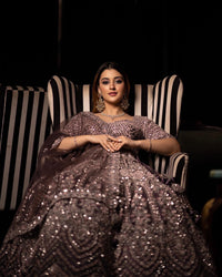 DARK LAVENDER NET FLORAL SEQUINS LEHENGA WITH ALL OVER FRENCH KNOTS AND RESHAM HANDWORK