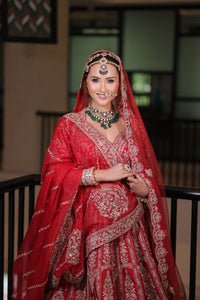 RED RAW SILK BRIDAL LEHENGA WITH ALL OVER ZARDOSI WORK AND THREAD OF MULTICOLOURED FLOWERS