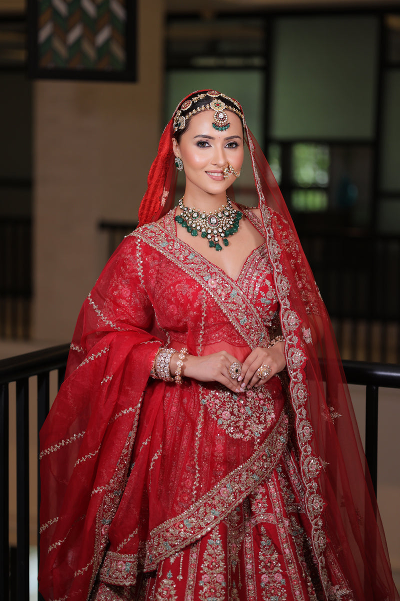 RED RAW SILK BRIDAL LEHENGA WITH ALL OVER ZARDOSI WORK AND THREAD OF MULTICOLOURED FLOWERS