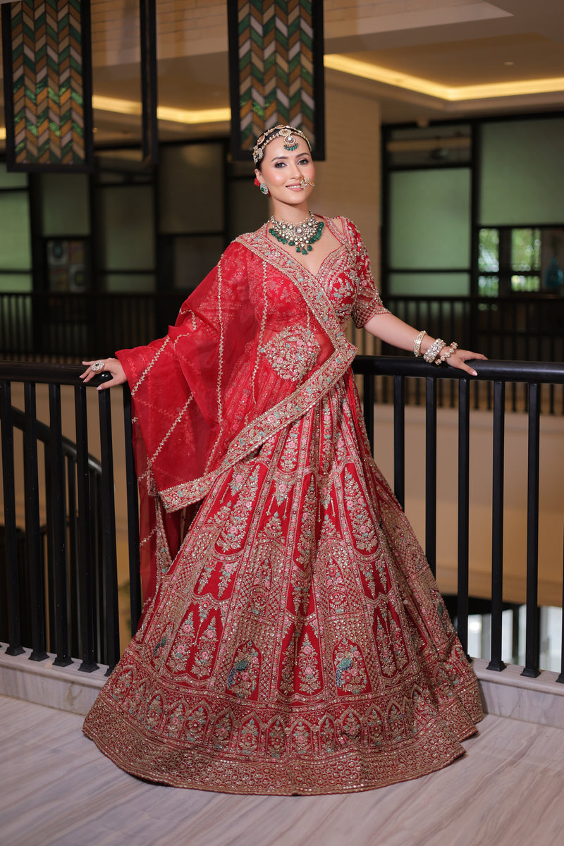 RED RAW SILK BRIDAL LEHENGA WITH ALL OVER ZARDOSI WORK AND THREAD OF MULTICOLOURED FLOWERS