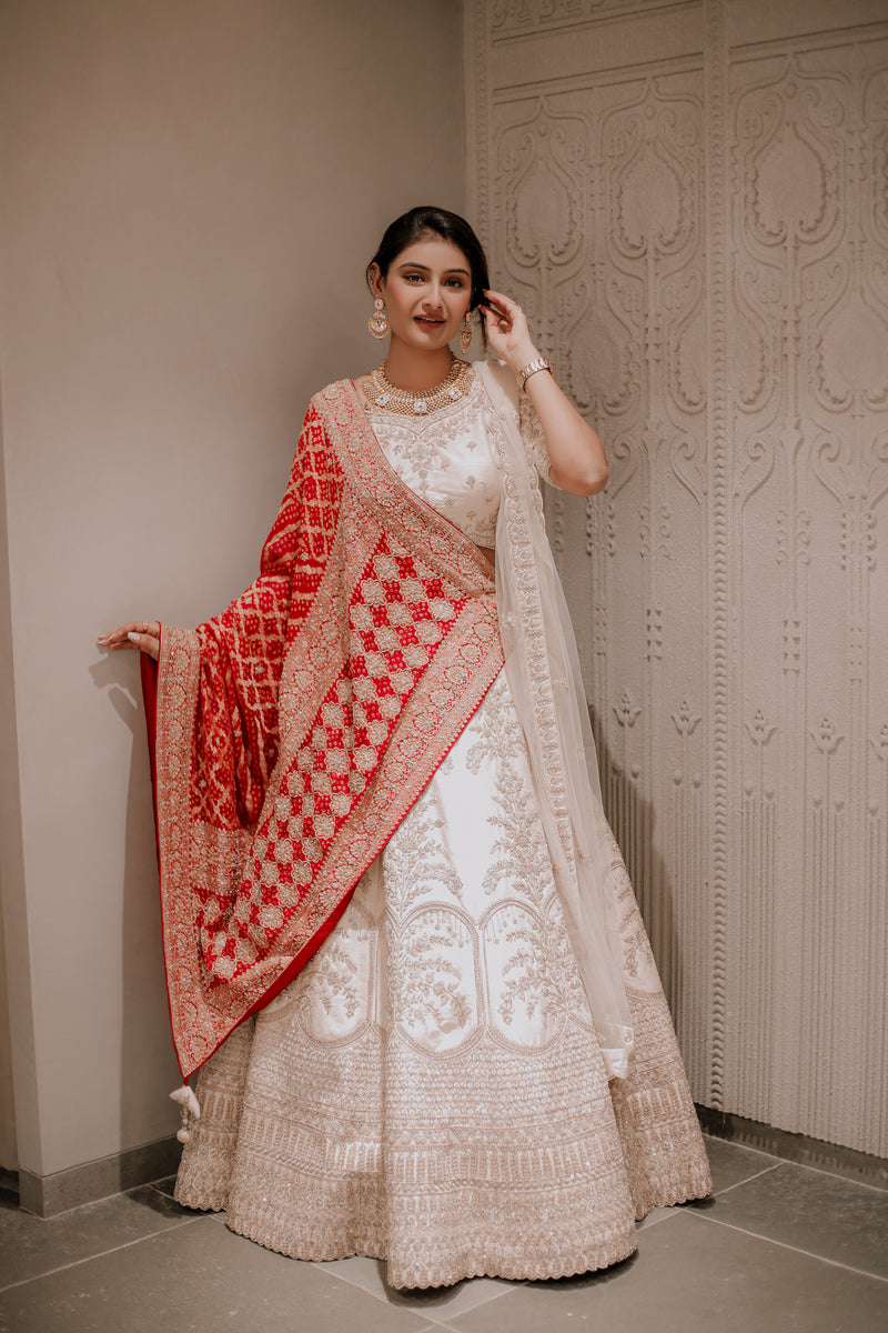 OFF WHITE RAW SILK RAJWADI BRIDAL LEHENGA WITH SELF THREAD AND ZARDOSI WORK